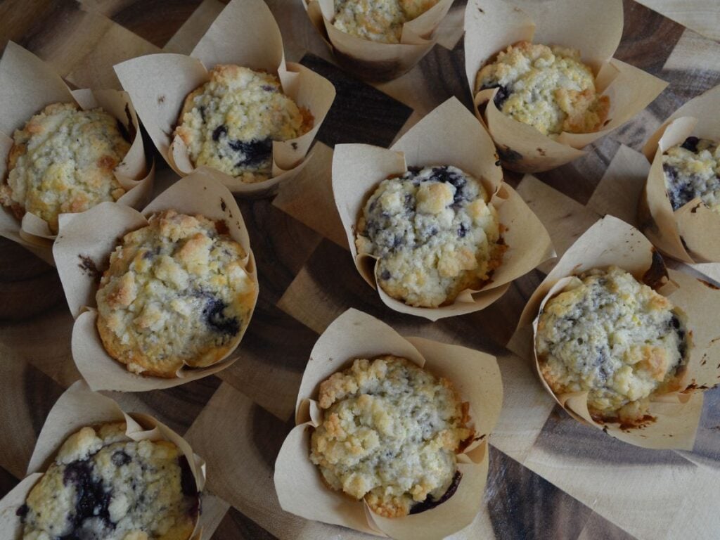 sourdough blueberry muffins laid out on cutting board