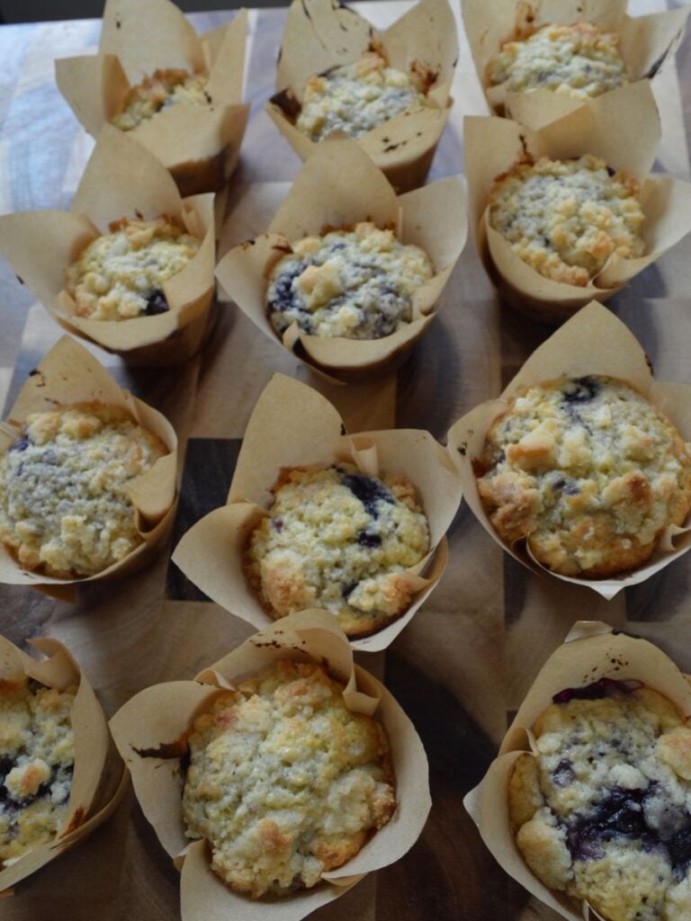 Sourdough blueberry muffins on cutting baord