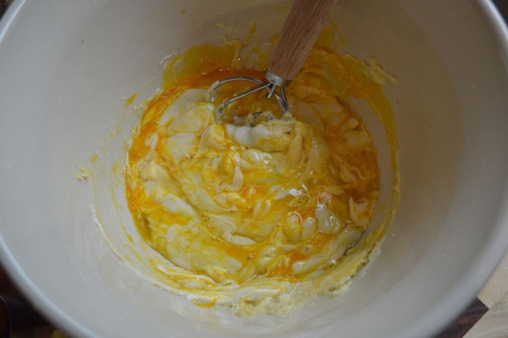 Wet ingredients in mixing bowl with whisk