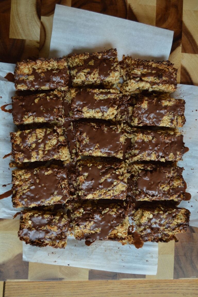 Chocolate drizzled granola bars on cutting board