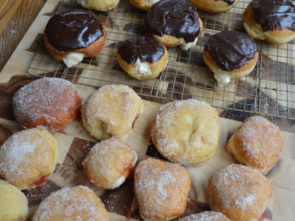 Donuts laid out on a cooling rack