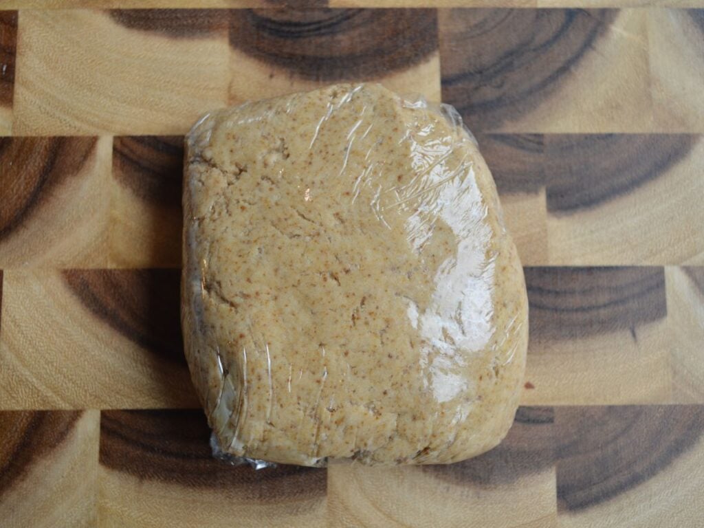 Graham cracker dough wrapped in plastic wrap